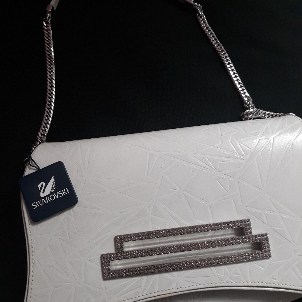 Swarovski purse brand new with 475$ price tag.